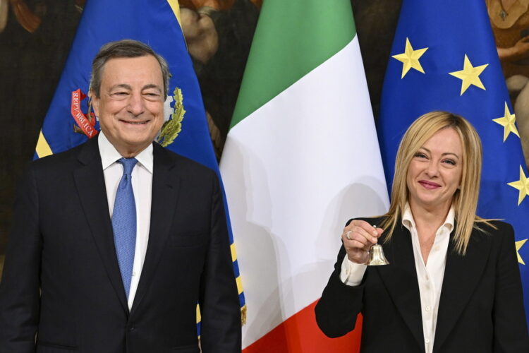 epa10260558 Italy's outgoing Prime Minister Mario Draghi (L) hands over the bell used by the cabinet president to manage cabinet debates to Prime Minister Giorgia Meloni (R) during the handover ceremony at Chigi Palace in Rome, Italy, 23 October 2022. Newly elected Prime Minister Giorgia Meloni and her cabinet were sworn in on 22 October.  EPA/ETTORE FERRARI