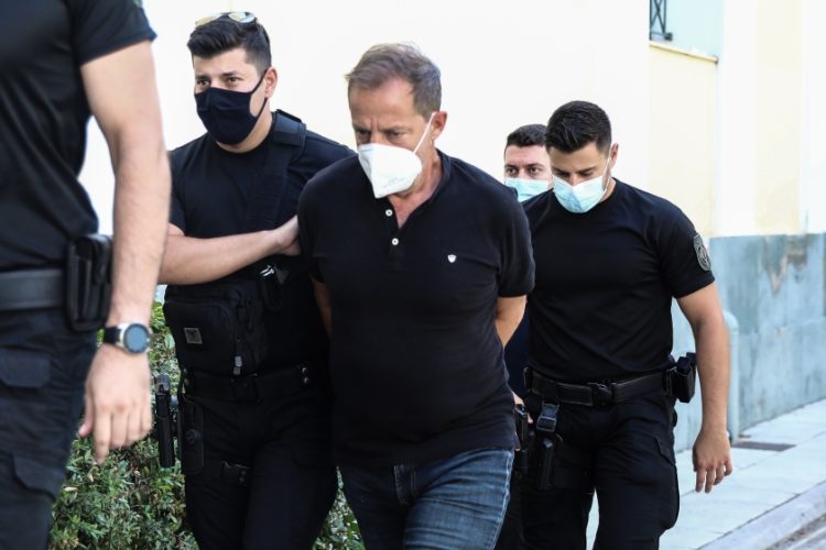 Ο Δημήτρης Λιγνάδης την ημέρα που οδηγήθηκε στον ανακριτή για συμπληρωματική απολογία, τον Ιούνιο του 2021.
(φωτ.: EUROKINISSI/Βασίλης Ρεμπάπης)