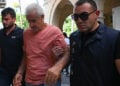 Συλληφθείς για το πολύνεκρο ναυάγιο του Filo Jet οδηγείται στο «δικαστήριο» της κατεχόμενης Κερύνειας (φωτ.: AA / Harun Özalp)